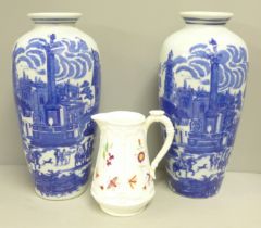 A pair of blue and white vases and a pottery jug