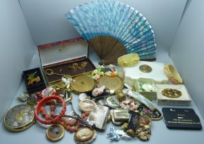 A collection of costume jewellery, compacts, etc.