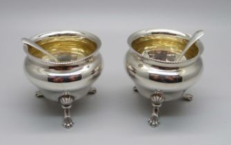 A pair of silver salts and a pair of silver salt spoons, 65g