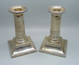 A pair of silver Corinthian column candlesticks, George Howson, Sheffield 1898, 13cm