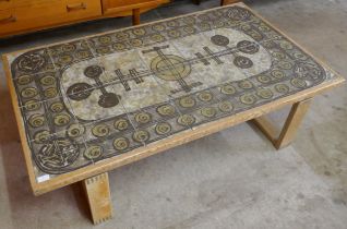 An oak and Ox-Art tiled top coffee table