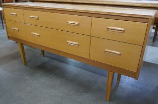 A teak six drawer sideboard