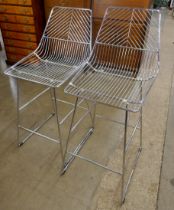 A pair of chrome geometric pattern bar stools