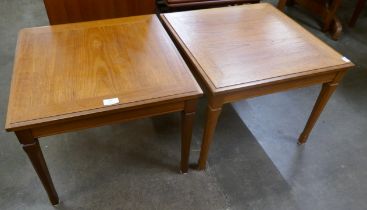 A pair of square teak lamp tables