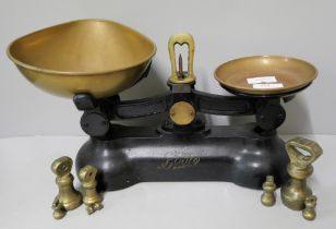 A set of Boots balance scales with some bell weights