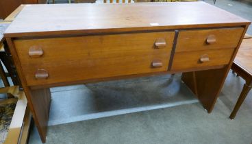 A Stag Cantata teak desk, designed by John & Sylvia Reid