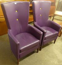 A pair of beech and purple leather highback armchairs