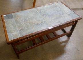 A Scandinavian teak and tiled top coffee table