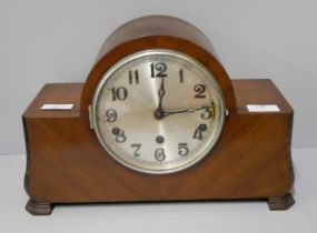 A wooden cased mantel clock