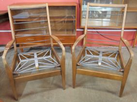 A pair of teak cocktail lounge chair frames