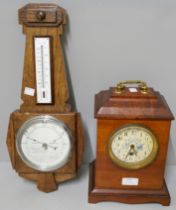 An Arts and Crafts mahogany mantel clock and an Art Deco oak barometer