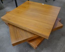 A walnut three tier revolving coffee table