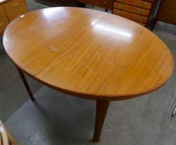 A teak oval extending table