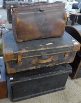 Two vintage steamer trunks and a suitcase
