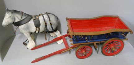 Two ceramic horses with wooden carriages, one a/f