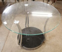 A circular glass and chrome coffee table