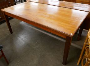 A teak rectangular dining table