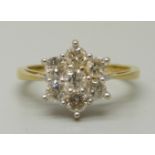 An 18ct gold, seven stone diamond cluster ring, total brilliant cut diamond weight 1ct, 3.7g, M