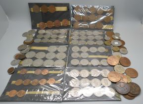 A collection of assorted coins including shillings and two shilling coins