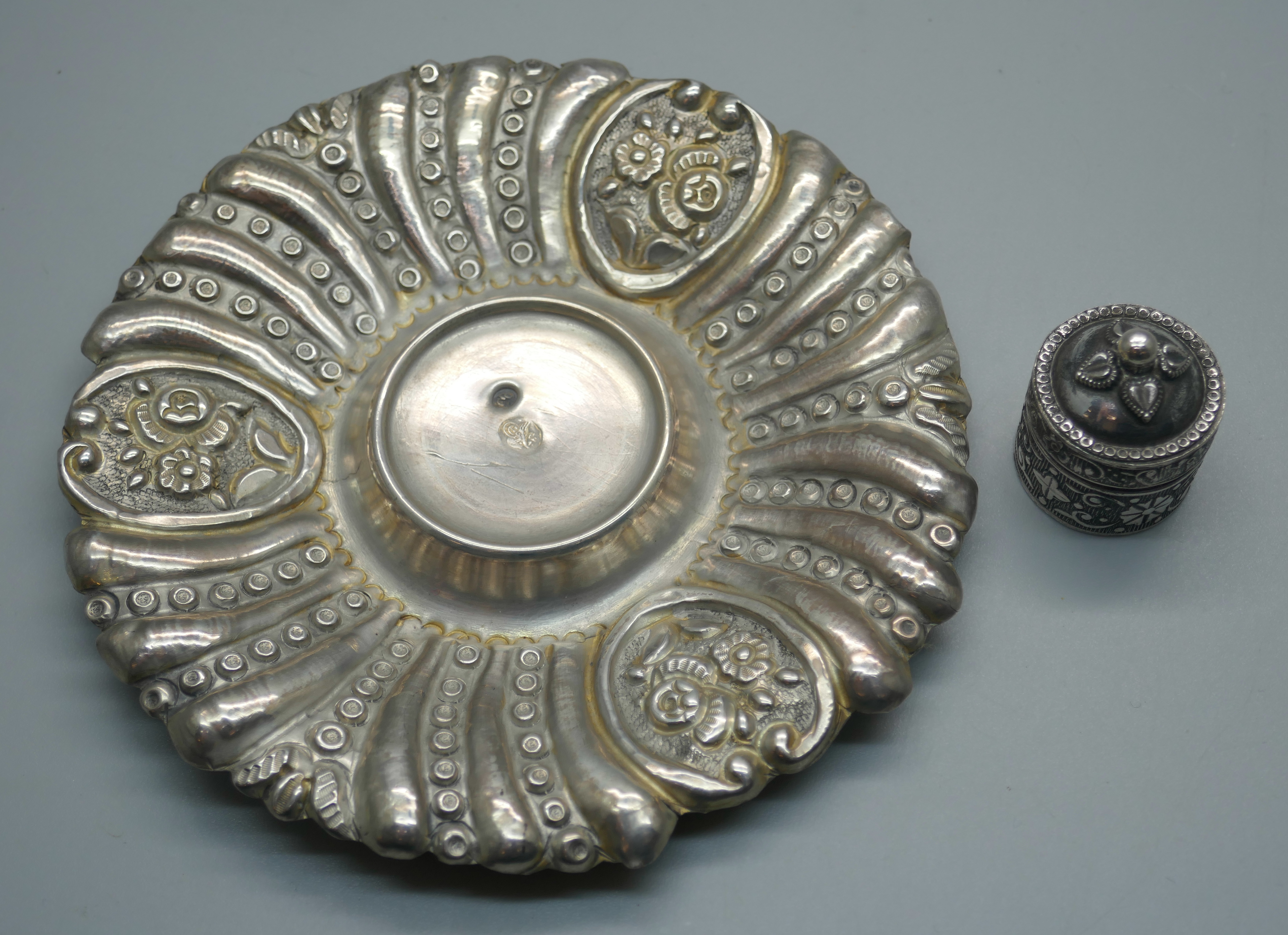 An embossed Ottoman silver dish and an embossed pill box, 49g