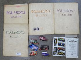 A collection of Rolls-Royce Bulletins and two Rolls-Royce badges and model cars