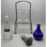 A WMF two bottle stand with two bottles, two other bottles, one with white metal 'soy' label and a