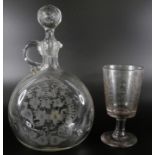 A 19th Century claret jug with engraved design and a circa 1900 glass with Lord Kitchener engraving