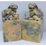 A pair of Chinese carved soapstone bookends, 16cm