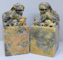 A pair of Chinese carved soapstone bookends, 16cm