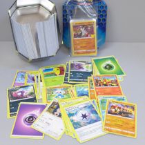 30 Holo/reverse holo, 300 common/uncommon and rare Pokemon cards