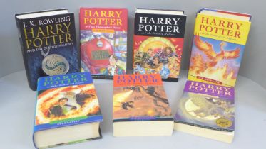 Seven Harry Potter novels, including four first editions