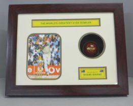 A cricket display, photograph and signed Morgan's cricket ball by Shane Warne, 'The World's Greatest