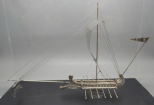 A silver model of an ancient Greek warship, marked 925 and 999, in a Perspex case, height of case