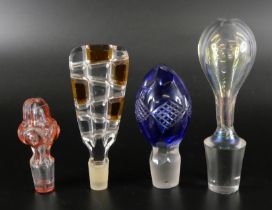 A large collection of glass stoppers