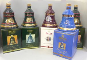 Five Wade Bell's Whisky decanters comprising three Christmas decanters and two bottles of Extra