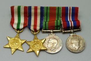 A set of WWII miniature medals including a Defence medal