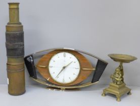 A Metamec Art Deco style clock, an Indian brass candle stand and a leather bound telescope