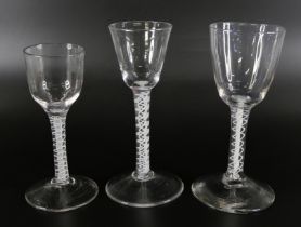 Three 18th Century wine glasses with double series opaque twists