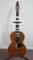 A parlour guitar made by Giovanni Kasermann of Naples, Italy in 1928. Mother of Pearl inlay, fret