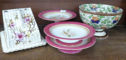 A Royal Doulton pedestal bowl, cheese dish and cover and three pieces of Royal Worcester, one