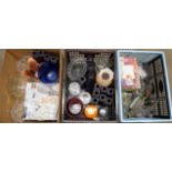 Three boxes of mixed glass including drinking game shot glasses, coloured glass vases, etc. **PLEASE