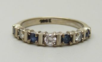 An 18ct white gold, sapphire and diamond ring, 3.3g, O