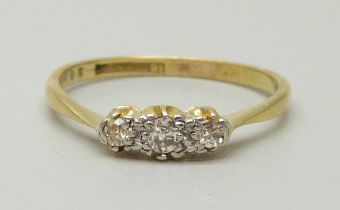 An 18ct gold and platinum set three stone diamond ring, 2.1g, P