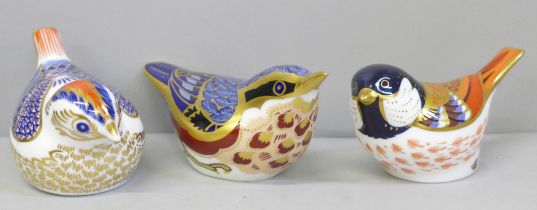 Three Royal Crown Derby paperweights, Goldcrest, Nuthatch and Coal Tit, two with gold stoppers,