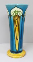 An early 20th Century Minton Art Nouveau vase of tapered form, circular base, signed Minton Ltd