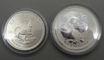 A 2017 silver Rooster 1oz coin and a silver Crocodile 1oz coin