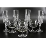 A set of four Baccarat brandy glasses, and a set of four Baccarat flutes