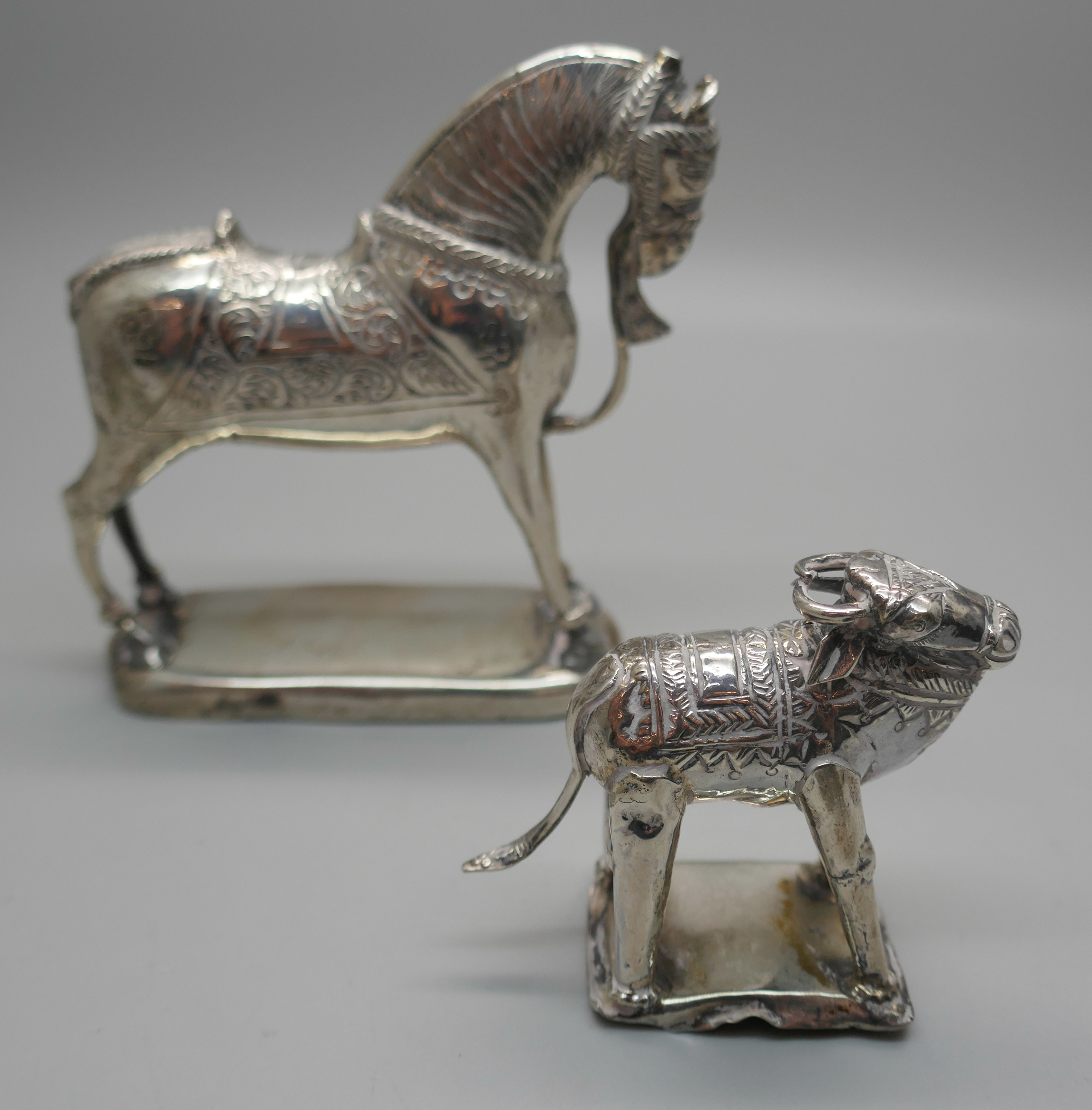 Two Eastern white metal model animals, horse and water buffalo, both test as silver, 194g