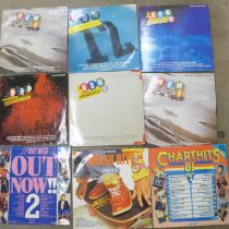 A collection of 1980s compilation LP records including Now That's What I Call Music, Smash Hits