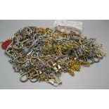 A collection of modern Albert chains including gold tone
